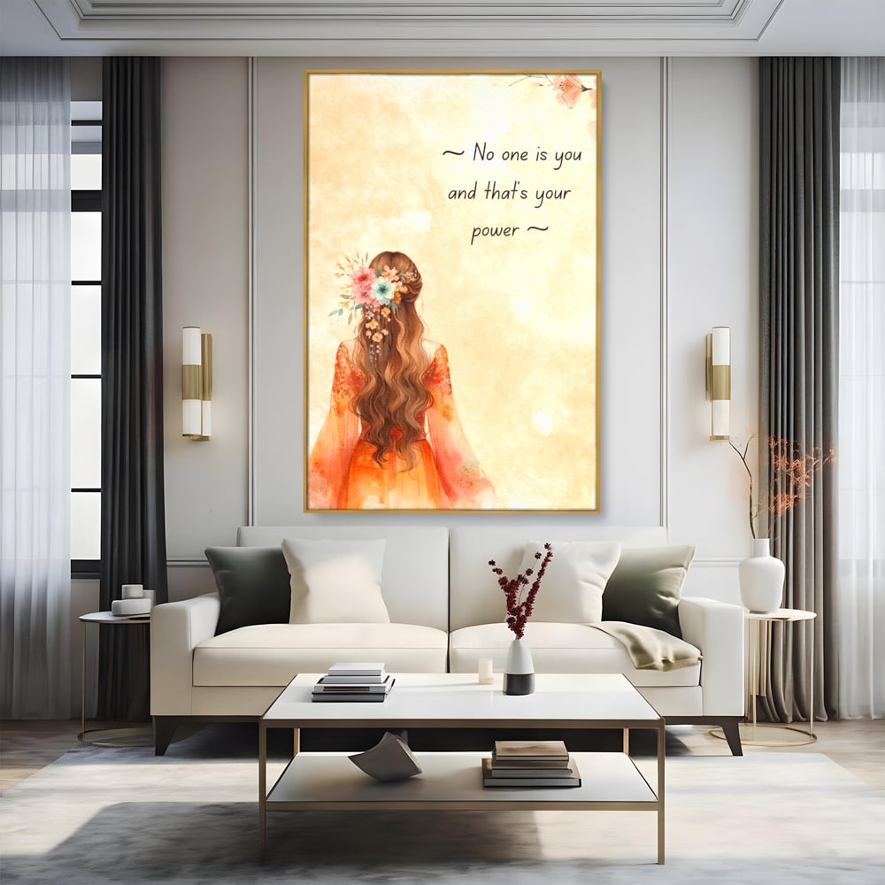 Tablou canvas cu tablou canvas cu femeie si flori, in rama de aluminiu auriu, pe perete intr-un living